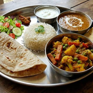 Veggie Thali ( Roti, Rice, Dal or Beans & Sabji)